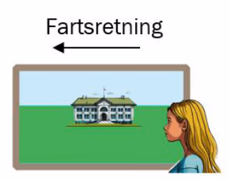 Line ser skolebygningen fra togvinduet, med fartsretning mot venstre